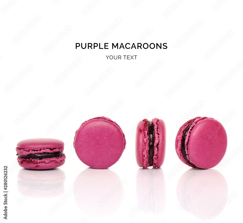 Creative layout made of purple macaroons on the white background. Flat lay. Food concept. 