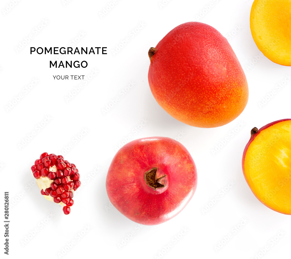 Creative layout made of mango and pomegranate. Flat lay. Food concept. Mango and pomegranate on whit