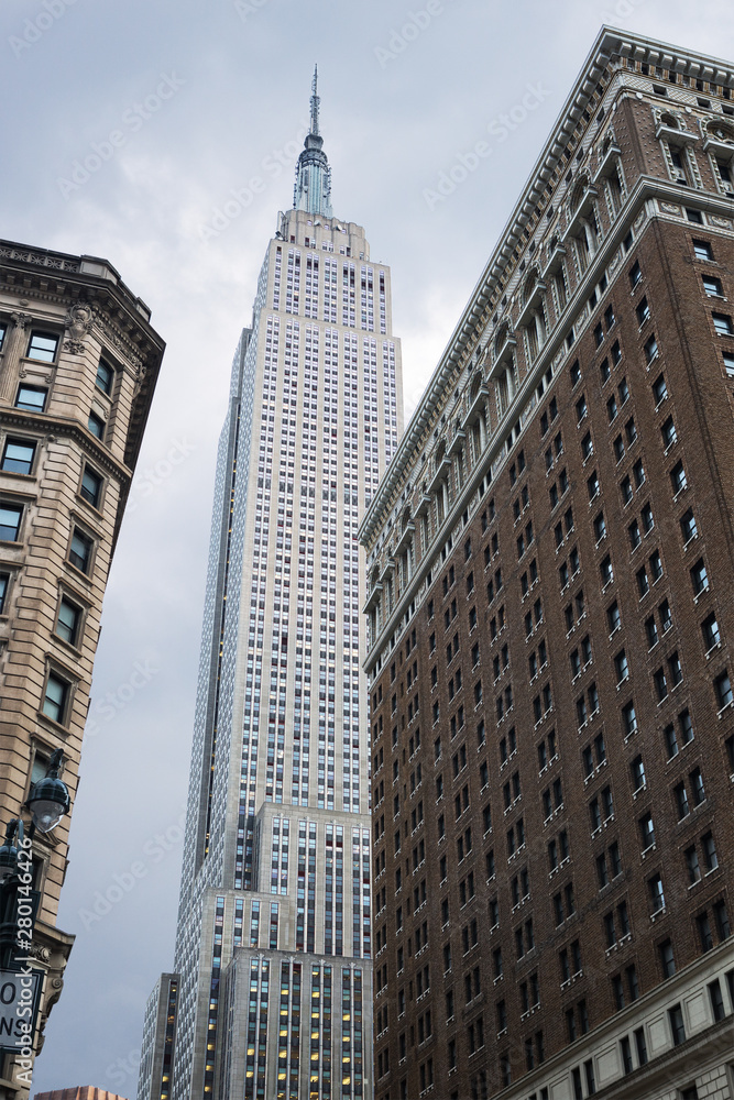 View looking up of the Empire State Building, seen from Herald Square,  New York City, United States