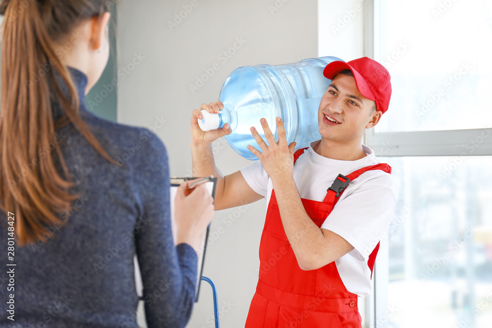 Man delivering bottle of water to customer