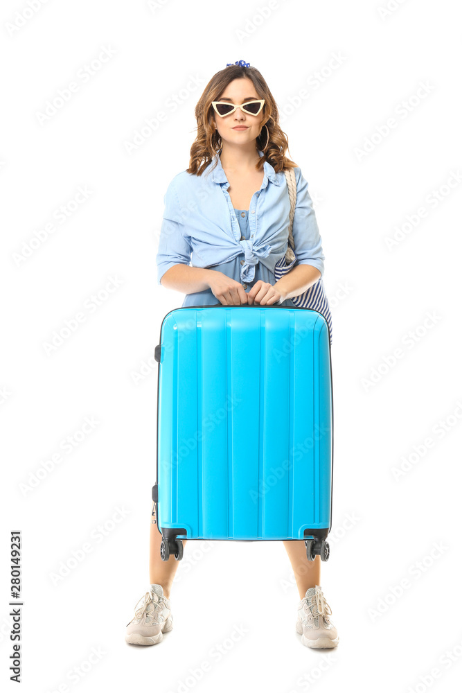 Female tourist with luggage on white background