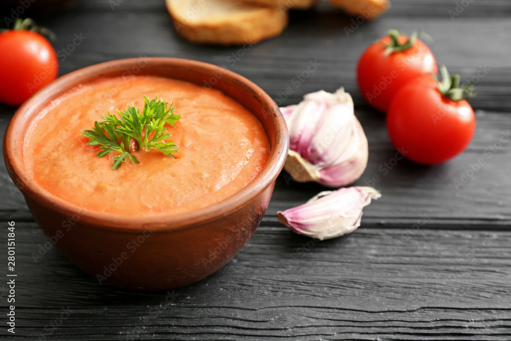 Bowl of tasty cream soup on table