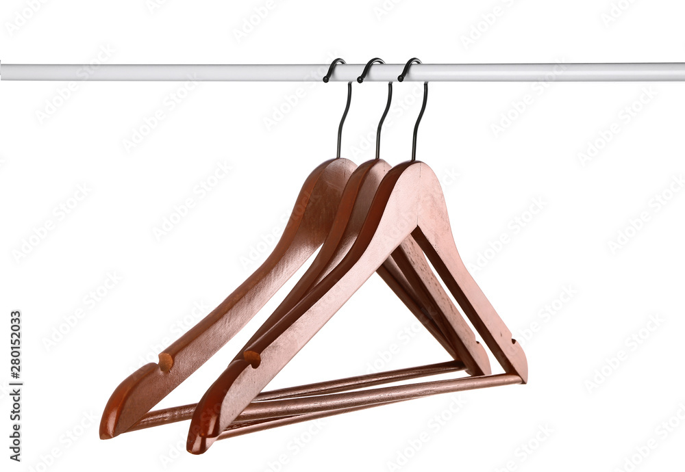 Rack with clothes hangers on white background