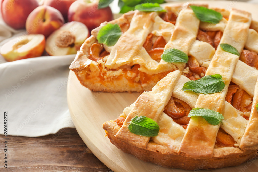 Tasty peach pie on table, closeup