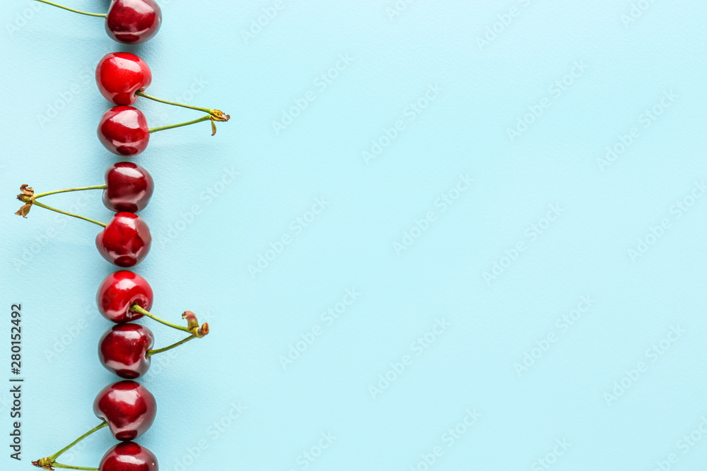 Sweet ripe cherry on color background