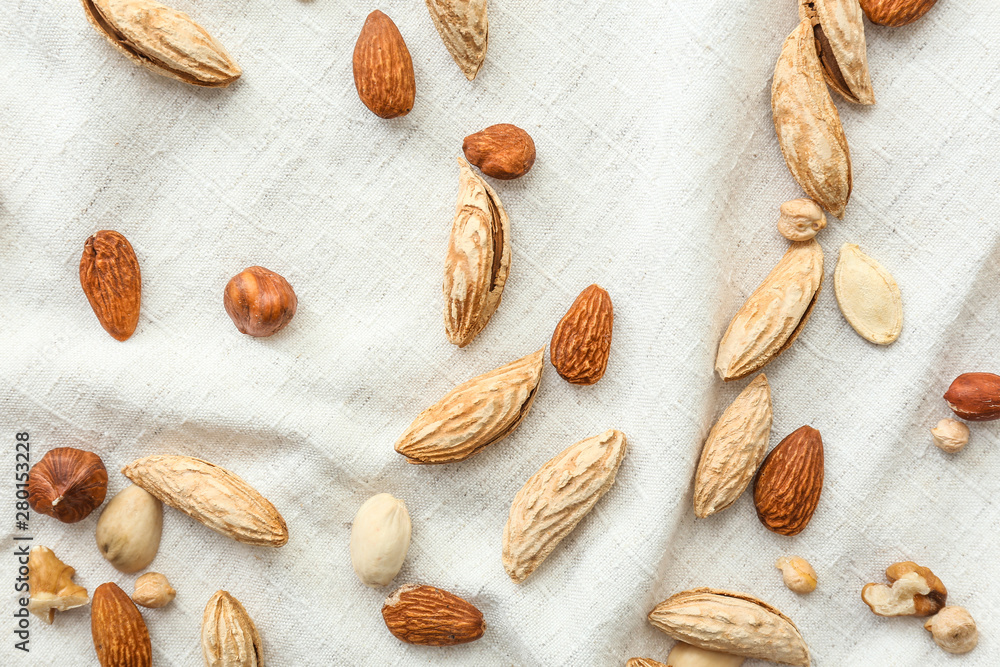 Many almonds on white cloth