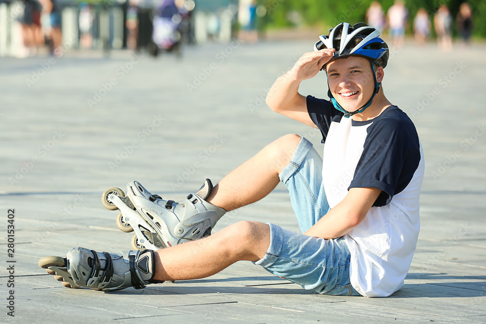 Teenage boy on roller skates outdoors