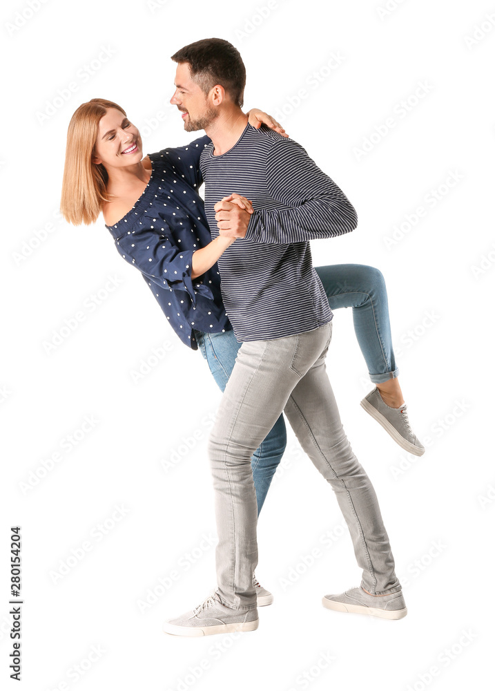 Portrait of dancing couple in love on white background