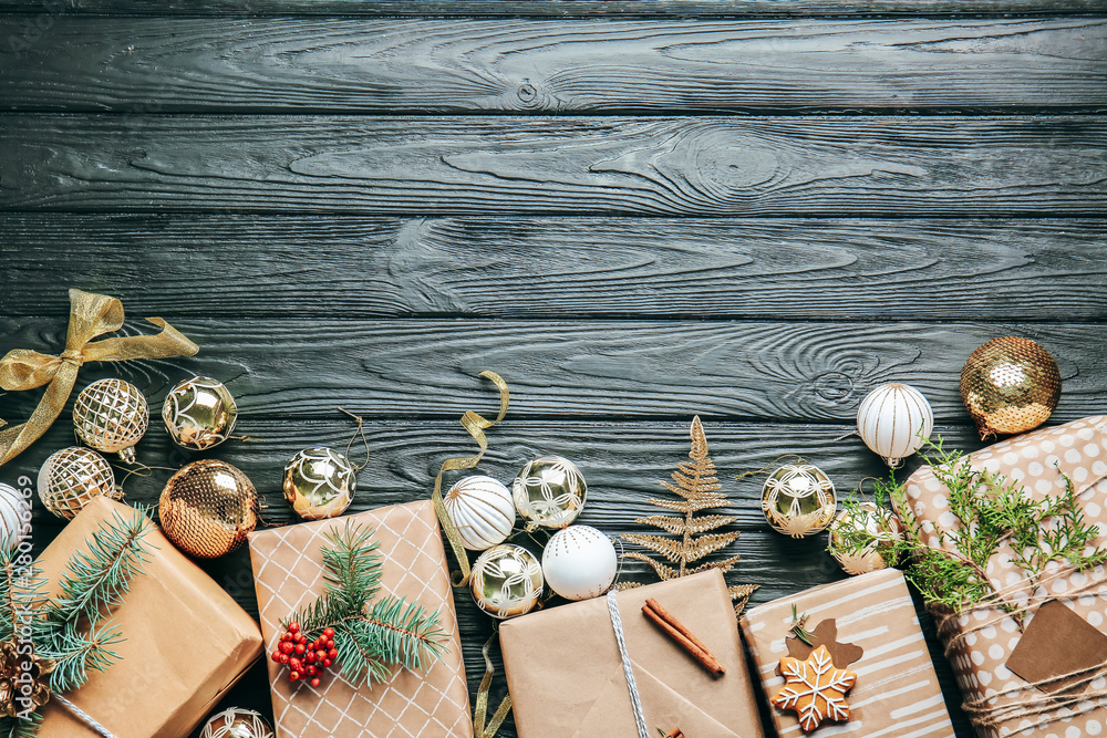 Beautiful Christmas gift boxes and decor on dark wooden background