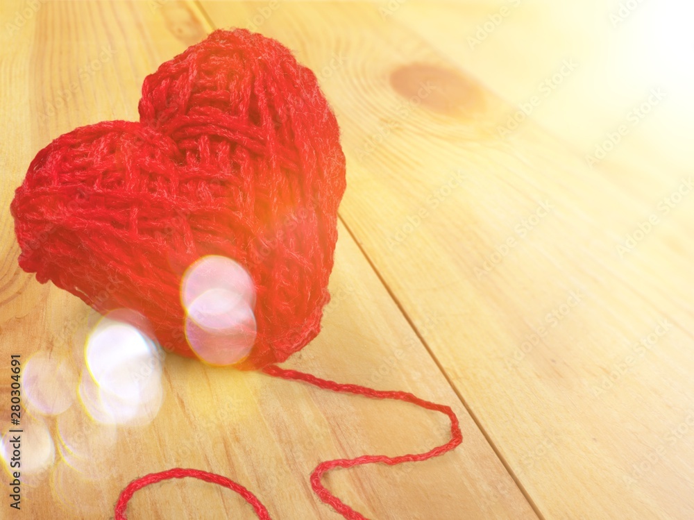 Tangle of red thread in heart shape