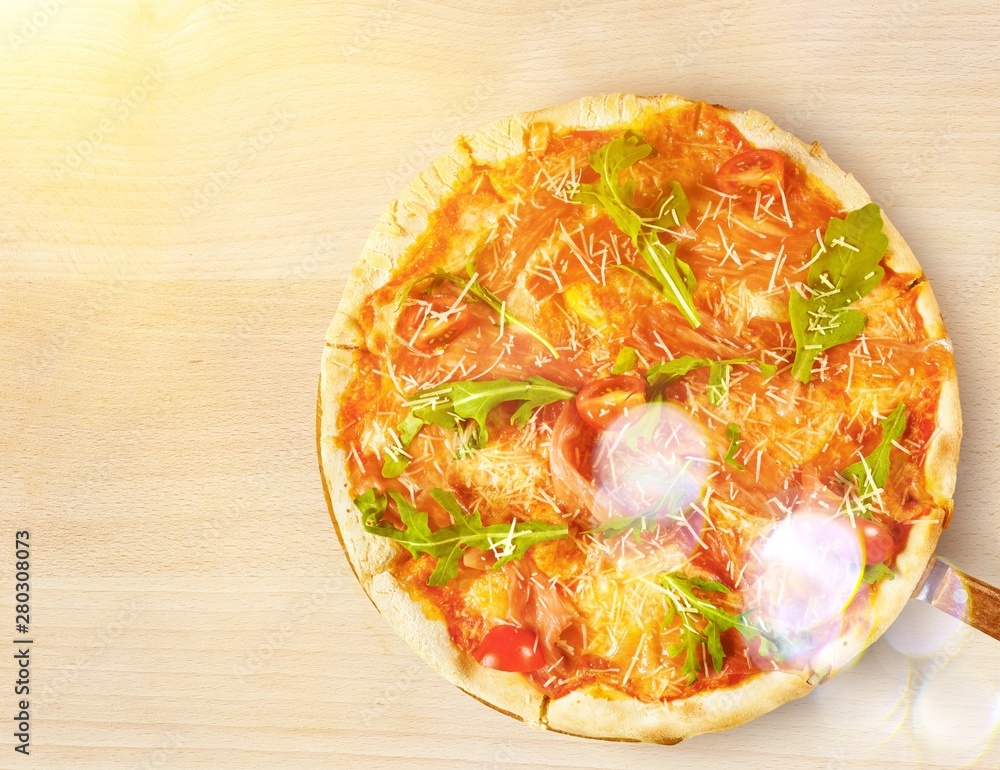 Freshly baked pizza on tray on white background, top view