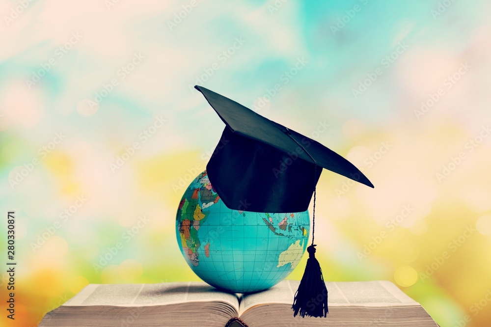 Heavy book and globe on background