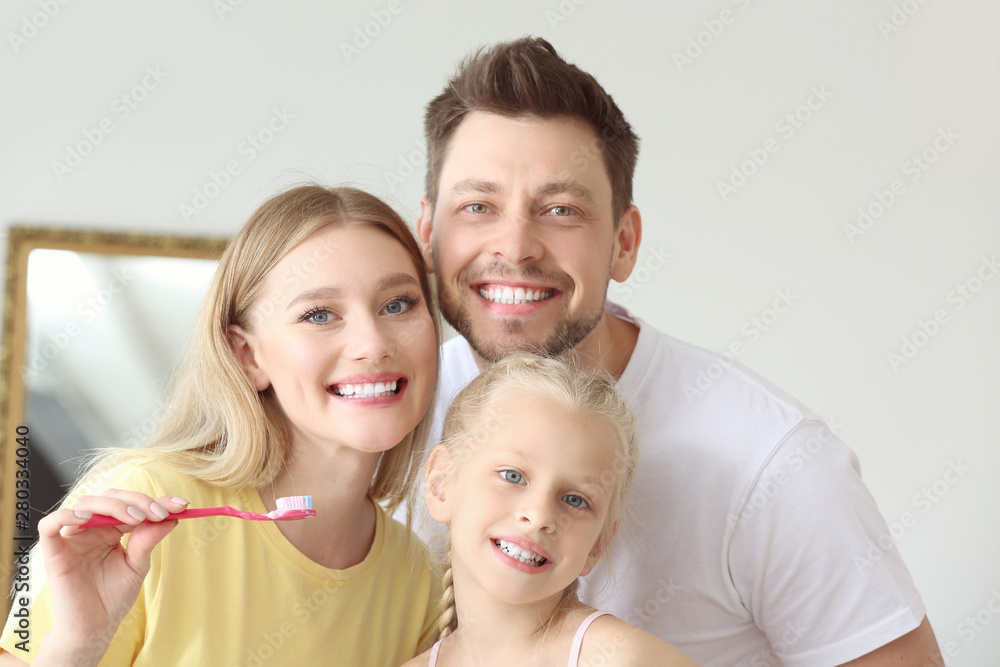 Family cleaning teeth at home