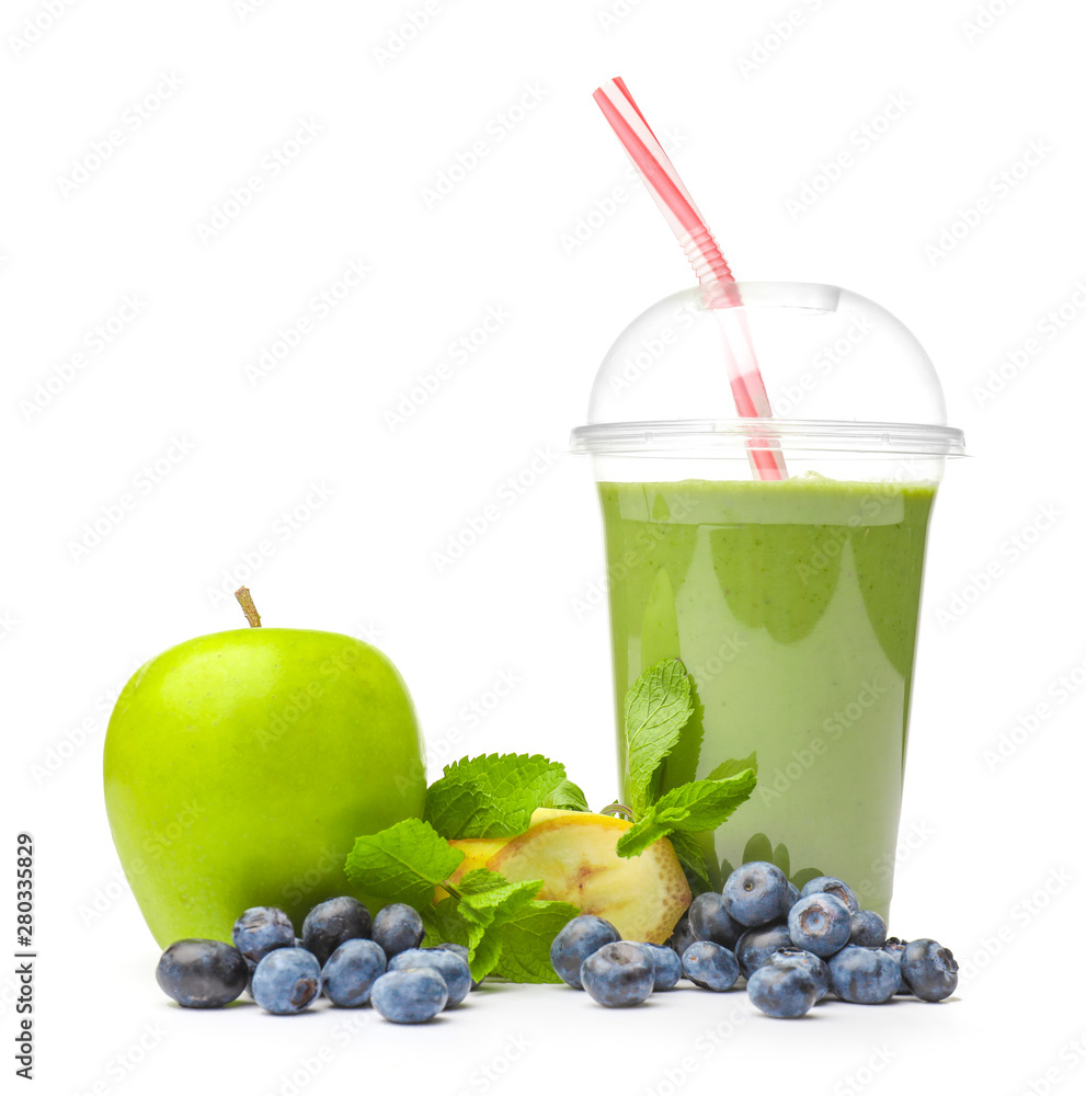 Cup of healthy smoothie and ingredients on white background