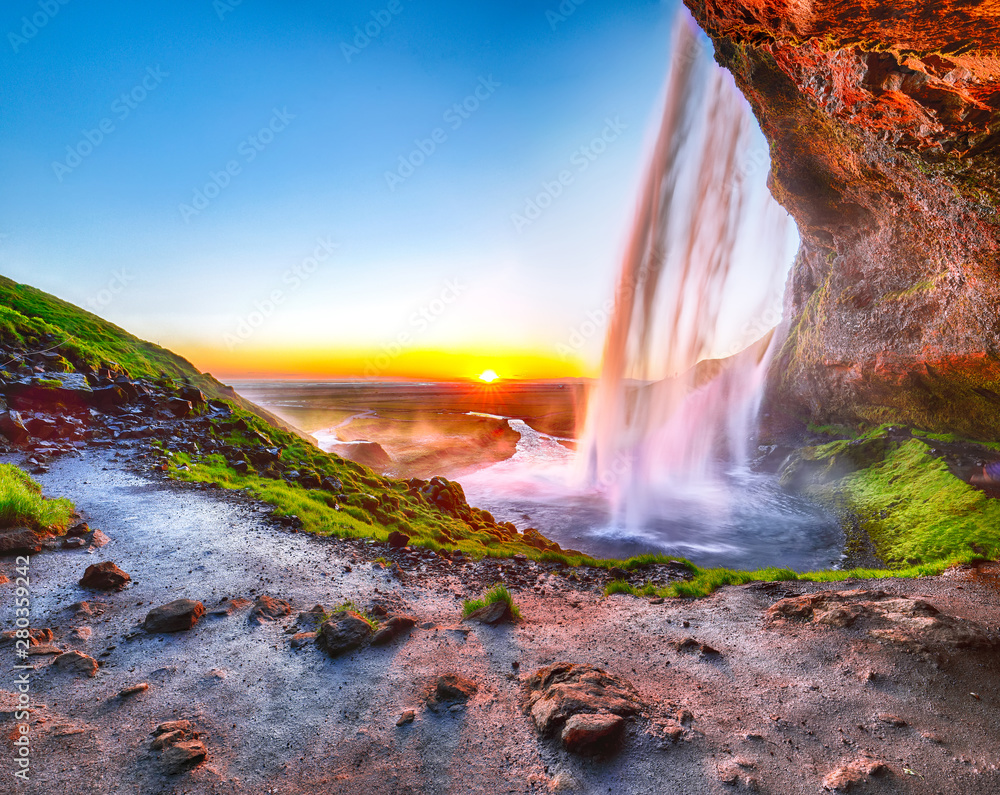 Beautiful  Seljalandsfoss waterfall in Iceland during the sunset