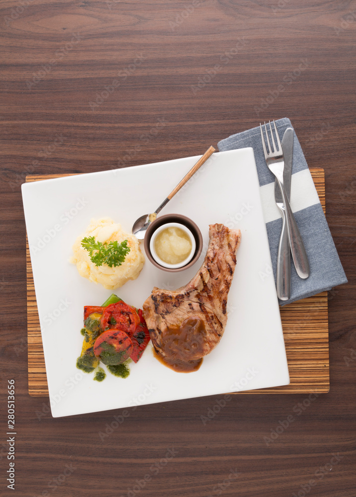 Pork chop ready to serve on tray