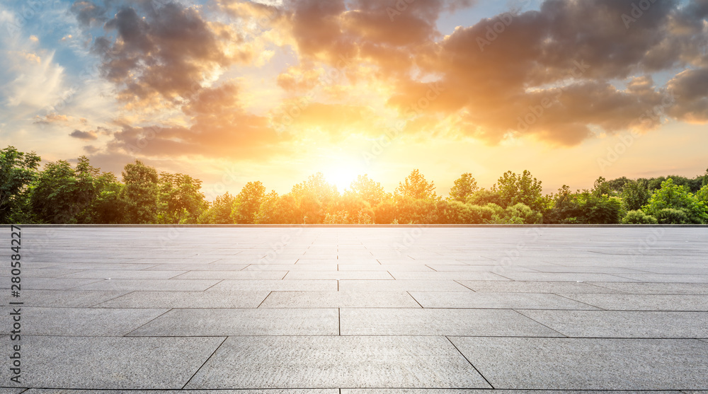 Empty square floor and green forest with beautiful clouds at sunset