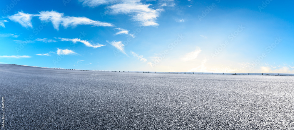 Asphalt highway and beautiful clouds landscape at sunset