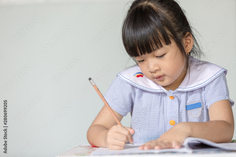 Little asian doing homework