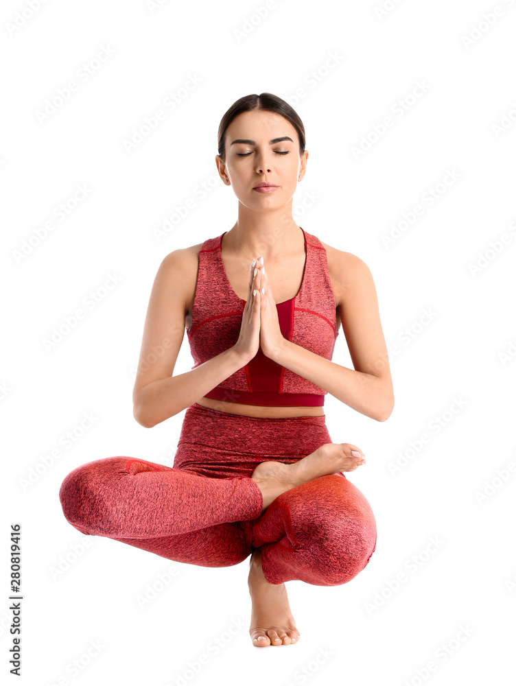 Sporty woman practicing yoga on white background