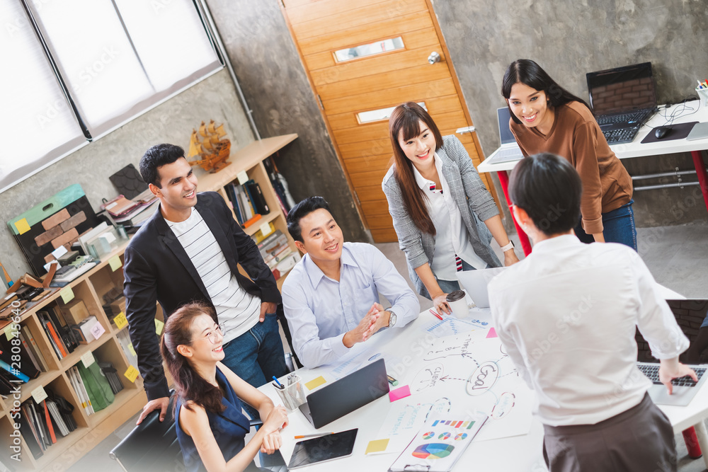 Group of Asian business people and creative designer meeting in office, top view