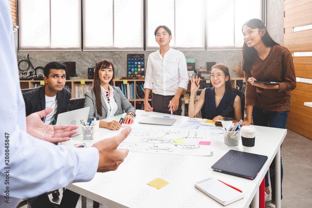 Group of Asian business people and creative designer meeting in office