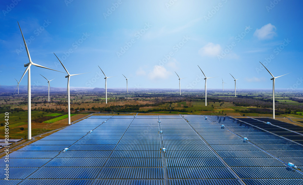 Solar energy panel photovoltaic cell and wind turbine farm power generator in nature landscape for p