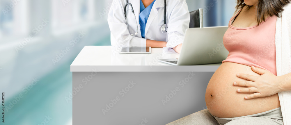 Happy pregnant woman visit gynecologist doctor at hospital or medical clinic for pregnancy consultan