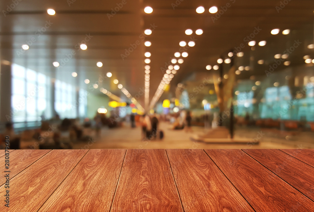 Wood table in conference hall background with empty copy space for product display.