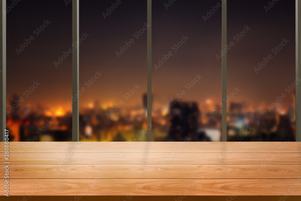 Wood table in city center modern office background with empty copy space on the table for product di