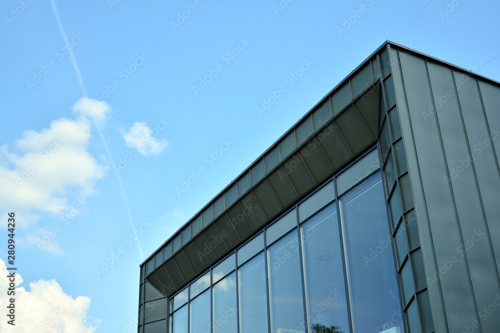 modern building with blue sky and clouds