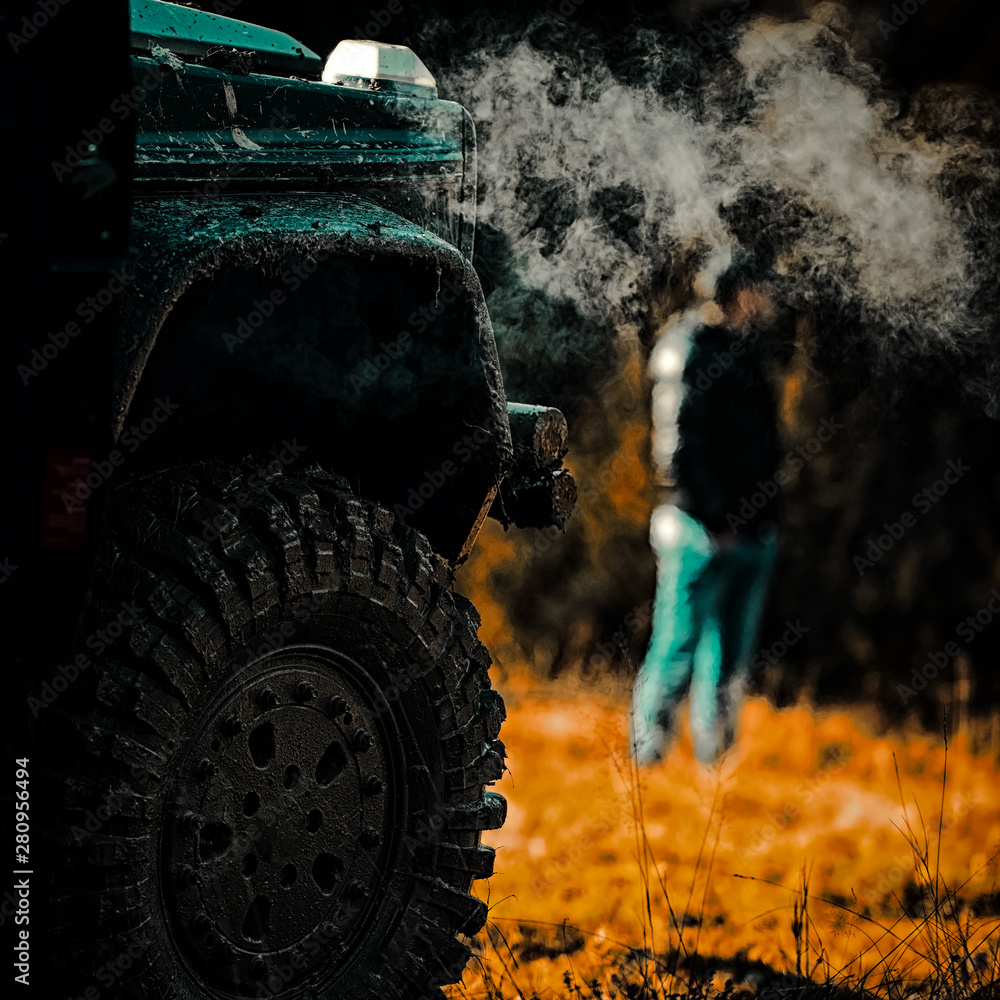 Drag racing car burns rubber. Extreme. Off-road car. Motion the wheels tires and off-road that goes 