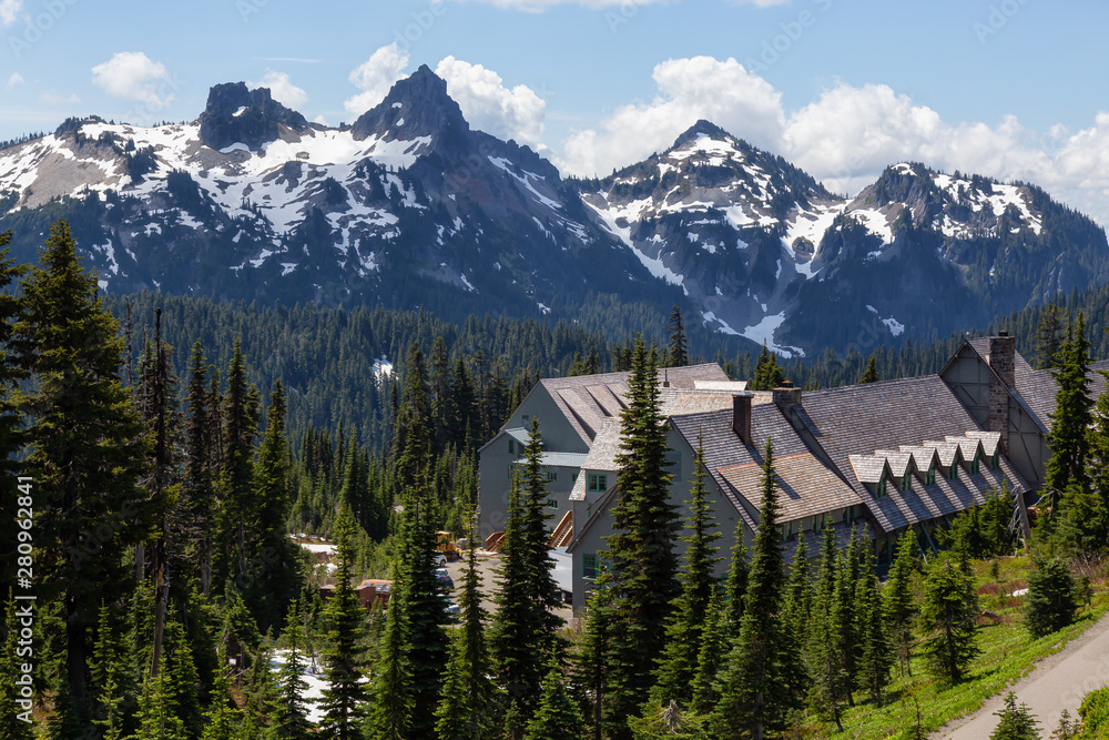 Beautiful American Mountain Landscape view with a Chalet during a sunny summer day. Taken in Paradis