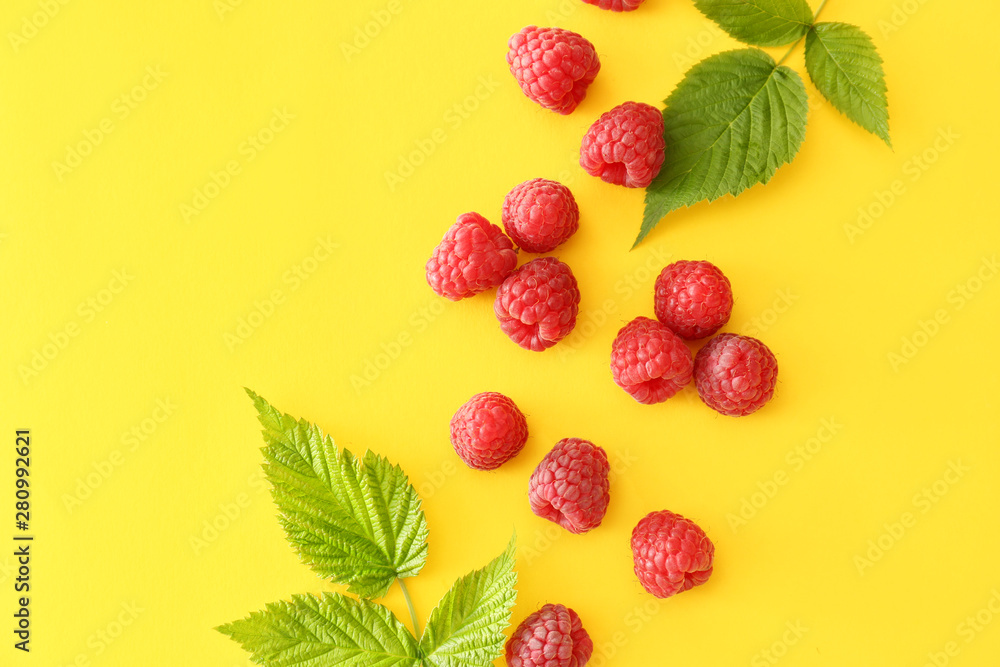 Sweet ripe raspberry on color background