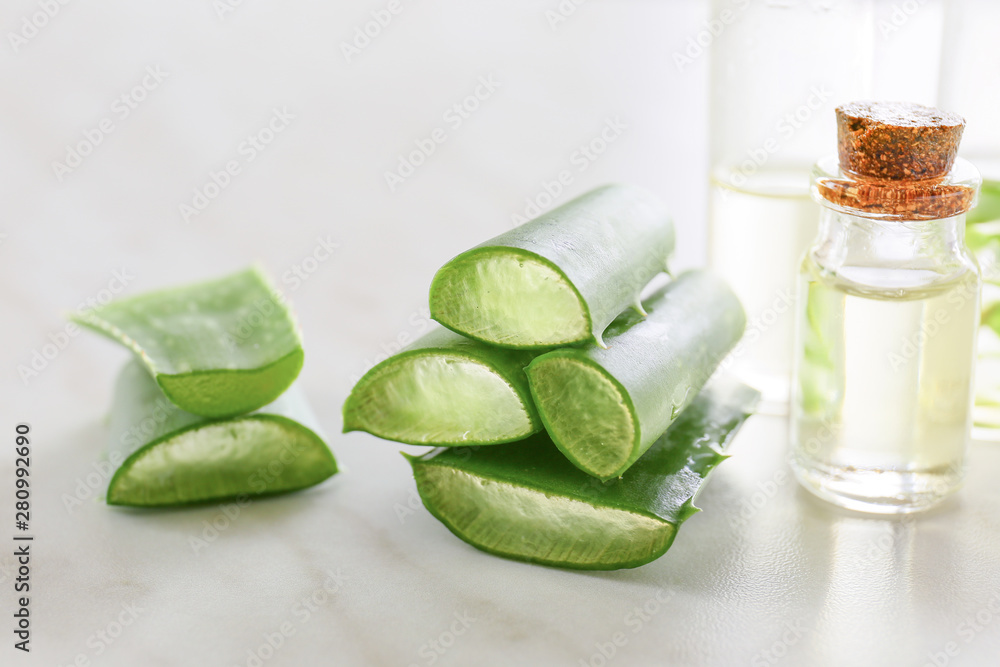 Composition with aloe vera and juice on light background