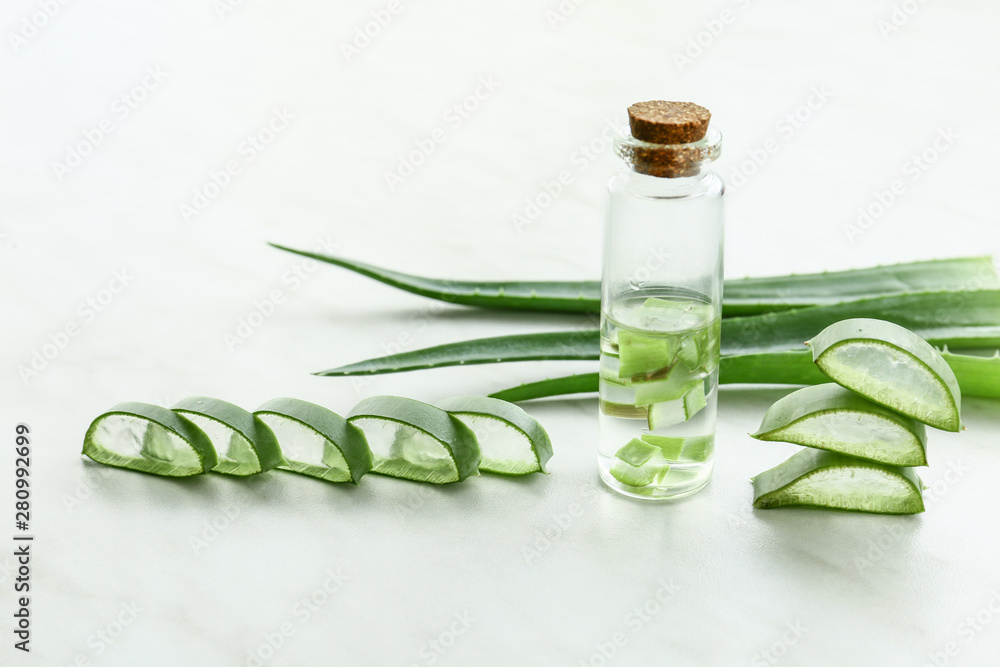 Composition with aloe vera juice on light background