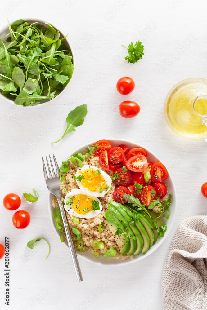 quinoa with boiled egg, avocado, tomato, arugula. healthy breakfast