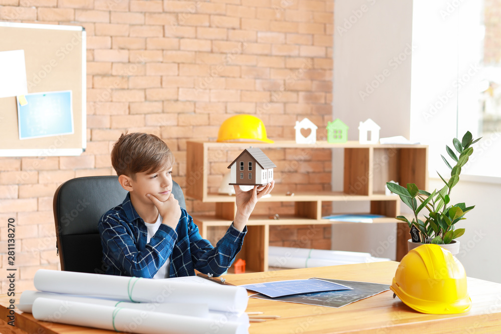 Cute little architect working in office