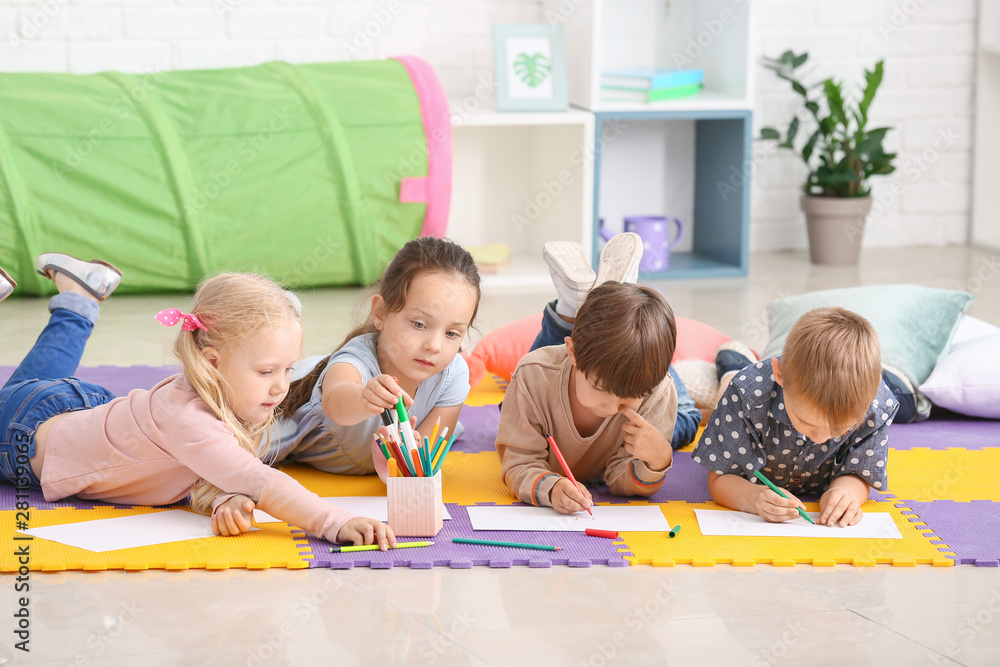 Cute little children drawing in kindergarten