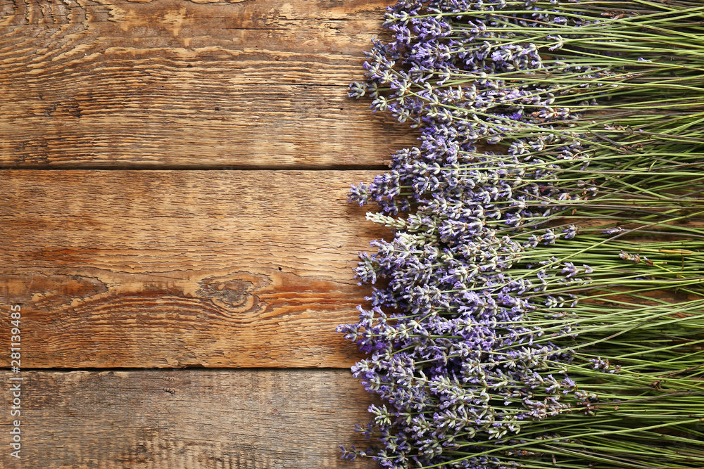 Beautiful lavender flowers on wooden background