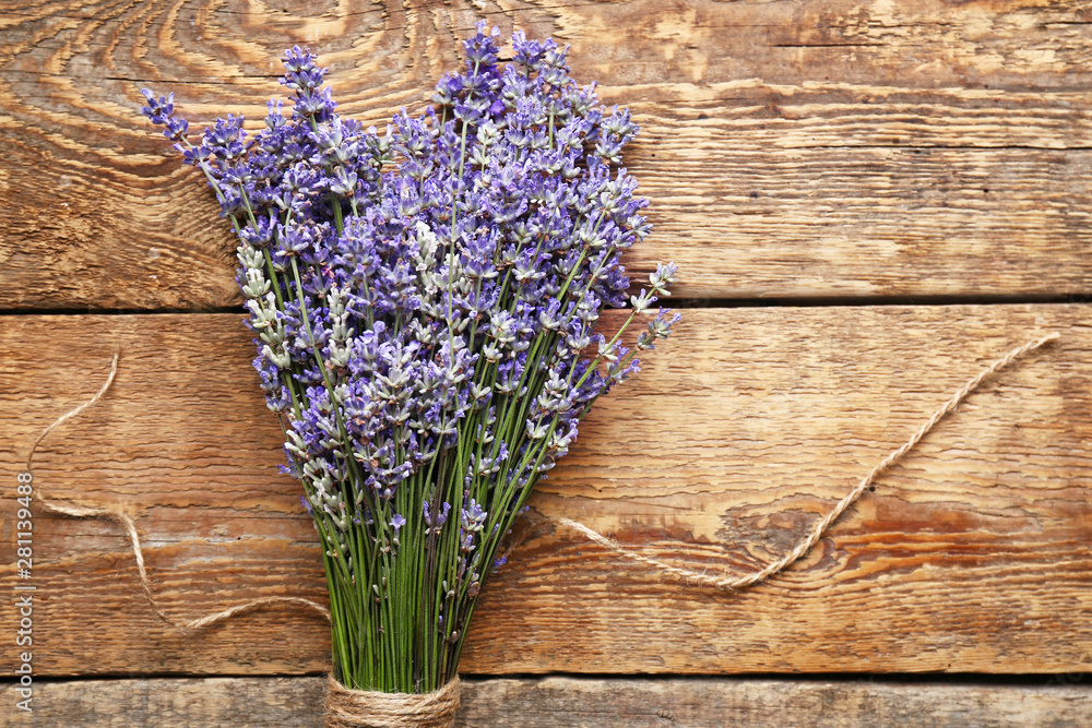 Beautiful lavender flowers on wooden background