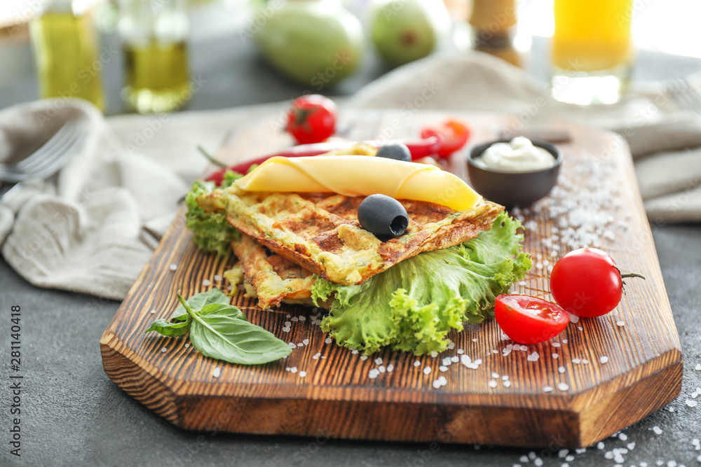 Tasty squash waffles on wooden board