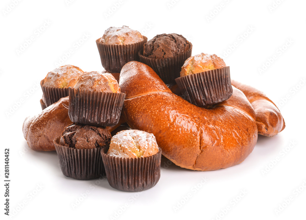 Heap of tasty pastries on white background