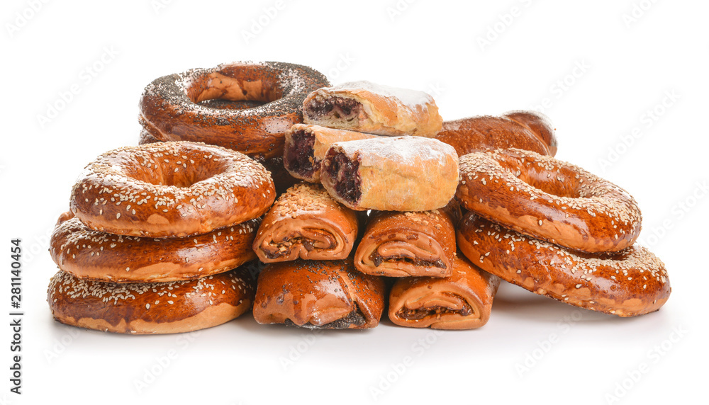 Heap of tasty pastries on white background