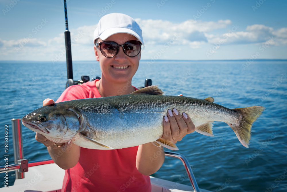 Woman angler with nice arctic char