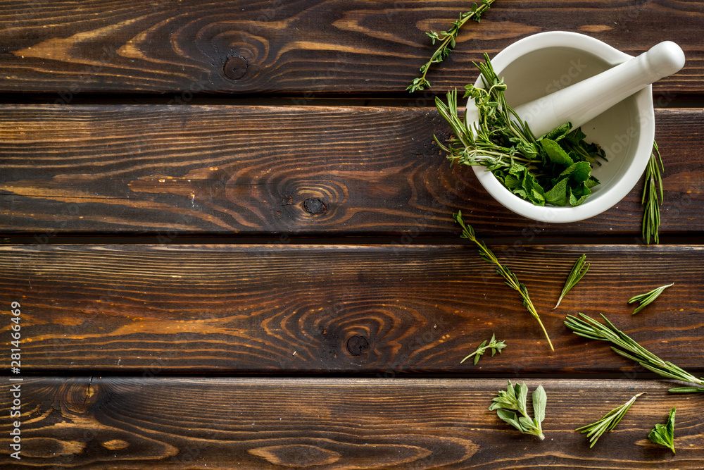 Store up medicinal herbs on wooden background top view space for text