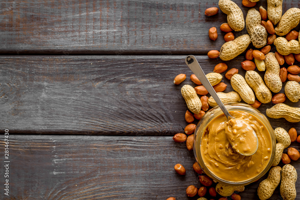 peanut butter for cooking breakfast at home on wooden background top view mock up