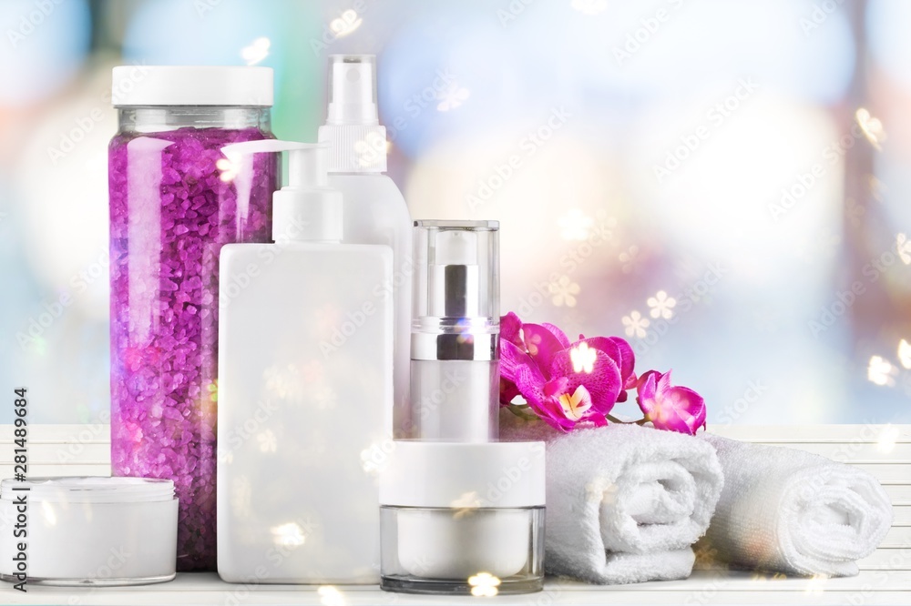 Set of cosmetic products in white containers isolated