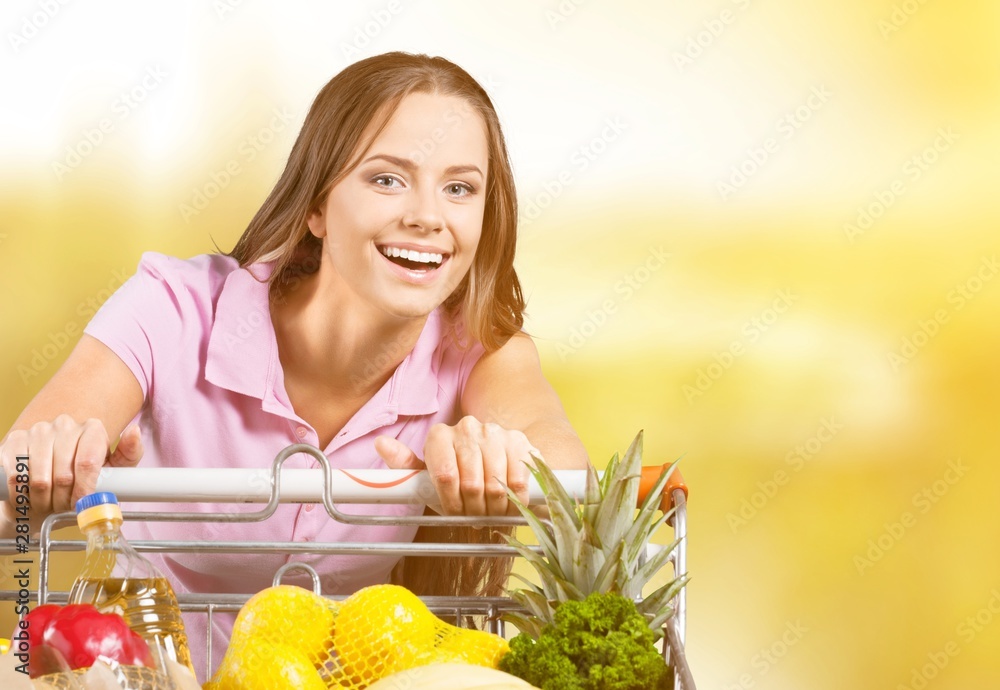 Young beautiful woman with fresh vegetables cooking