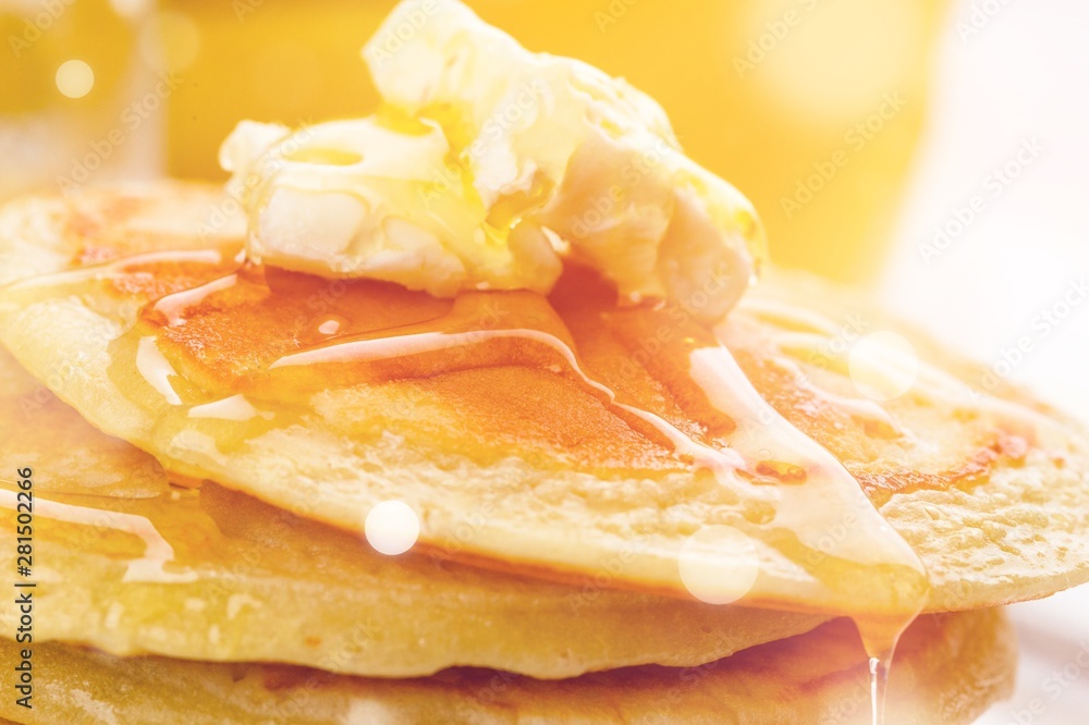 Stack of tasty pancakes with butter, close-up